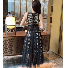Woman wearing a black lace dress in an indoor setting