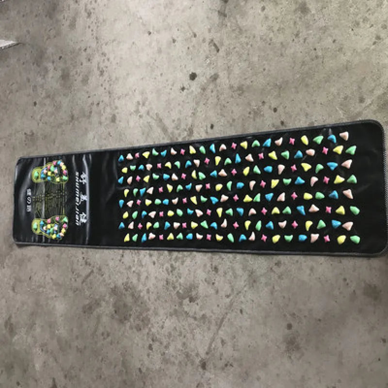 Colorful patterned mat on a concrete floor - reflexology mat