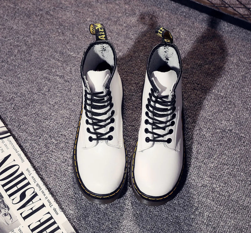 A pair of black Martin boots with a lace-up closure, showcasing the sole and heel.