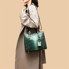 Person holding a green handbag against a beige background