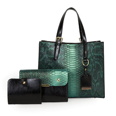 Green snakeskin handbag and black wallet on a white background