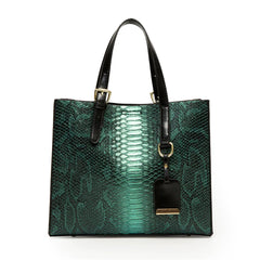 Green snakeskin pattern handbag with black handle on a white background