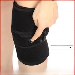 Black knee brace on a person's leg with a white background